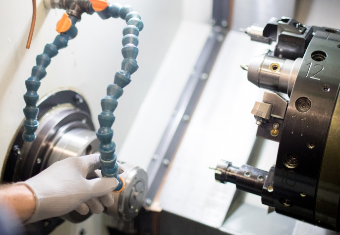 precision machining equipment processing metal parts at Meituo